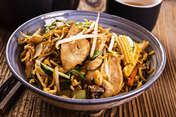 Asian wok dish with peanuts and chicken