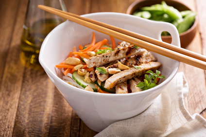 Asian salad with chicken breast strips and peanuts